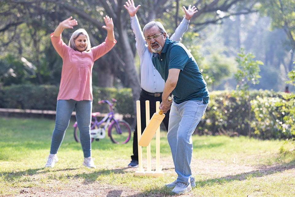 Seniors playing cricket